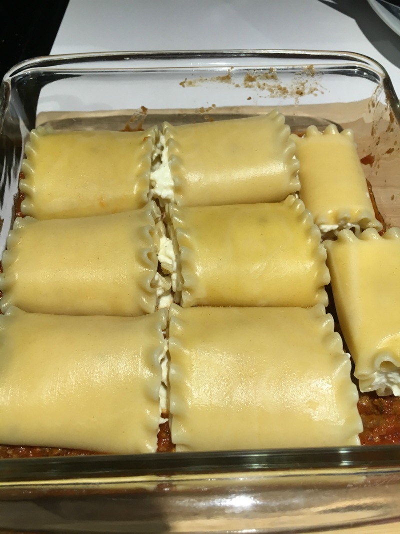 Place Lasagna Roll ups in a 8x8 baking dish and cover with sauce #CampbellSavings